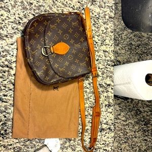 Louis Vuitton shoulder handbag.